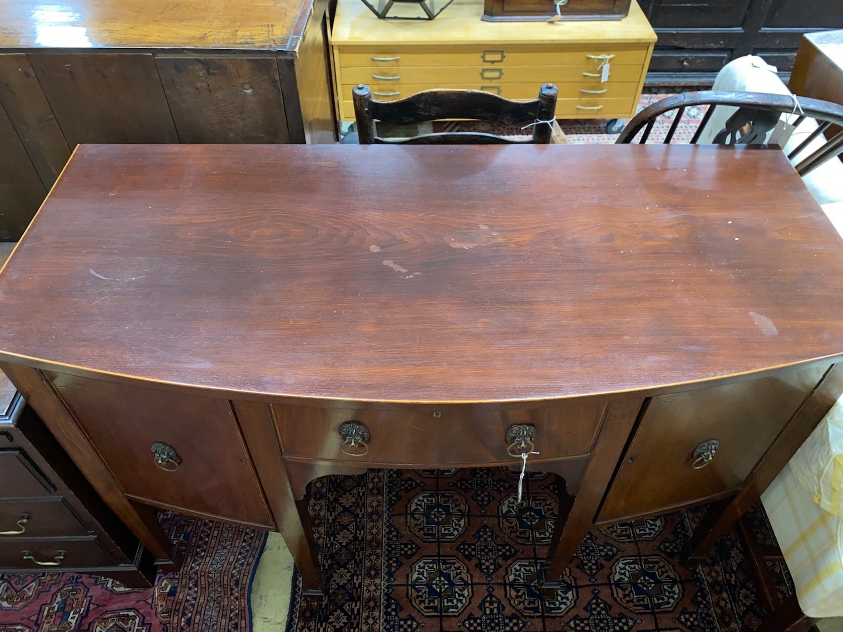 A George III style mahogany bowfront sideboard, length 138cm, depth 61cm, height 92cm